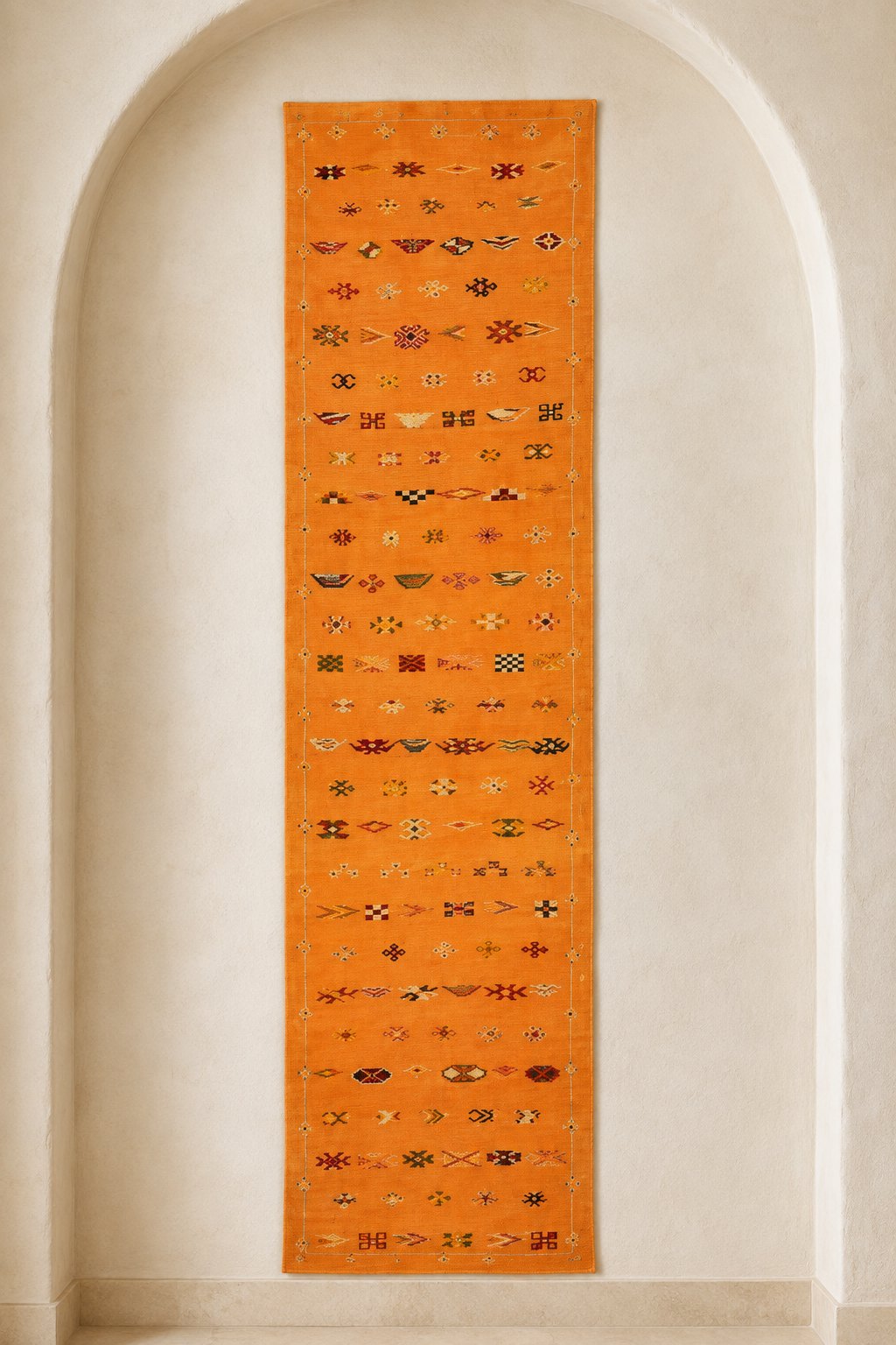 Ourika Moroccan flatweave runner in saffron orange with rows of small brocaded signs
